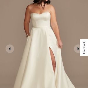 Strapless satin wedding dress with skirt slit and pockets. Style number WG4017